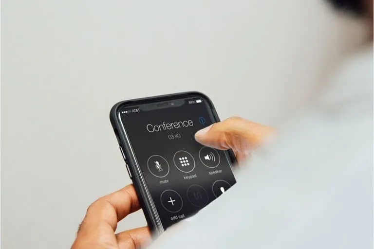 Dialling in to a strategy call on a mobile phone